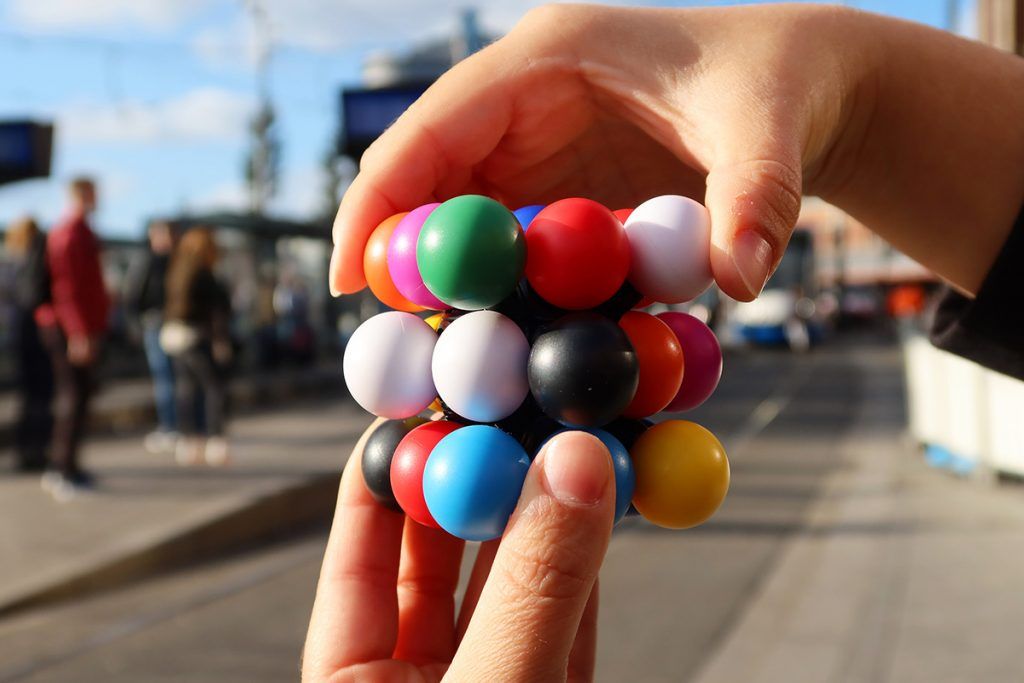 Addictive Smooth - Spinning Molecube Puzzle Toy with 9 - Color Challenge
