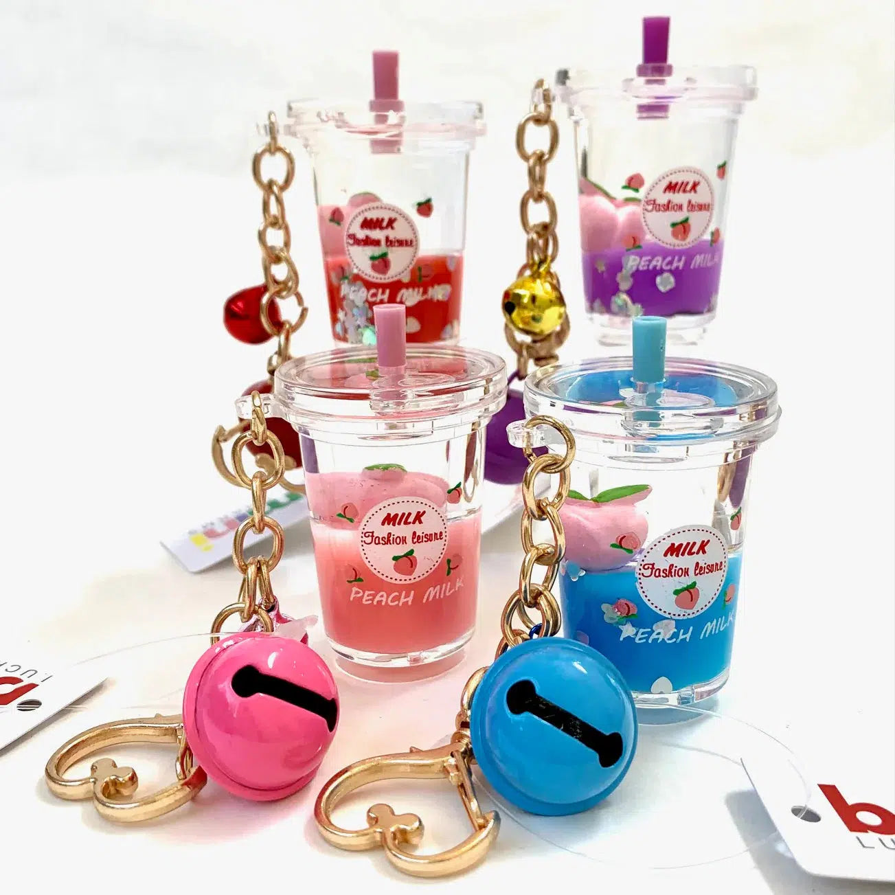 Floaty Key Charm with Peach Milk Design - A Charming Keychain Accessory